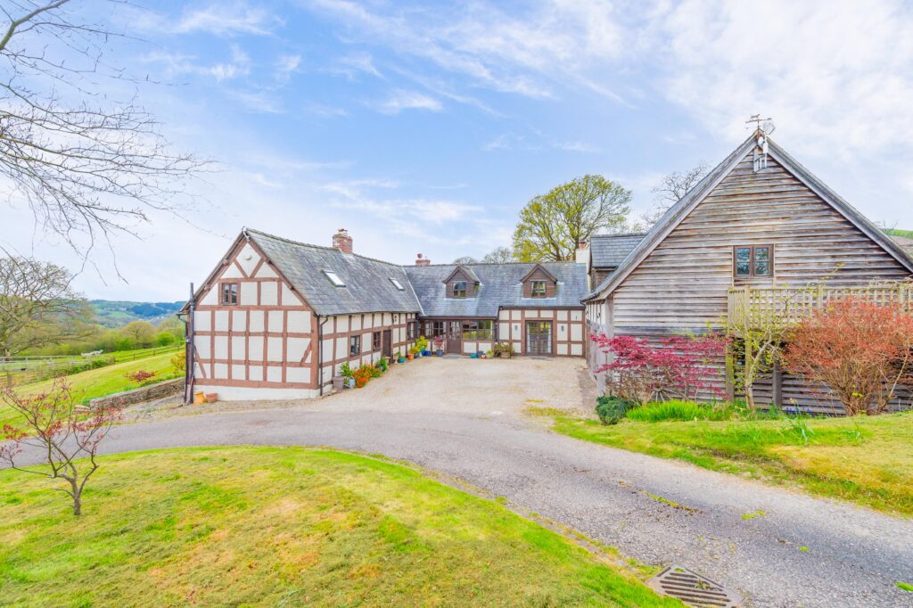 Borders property with land and outbuildings